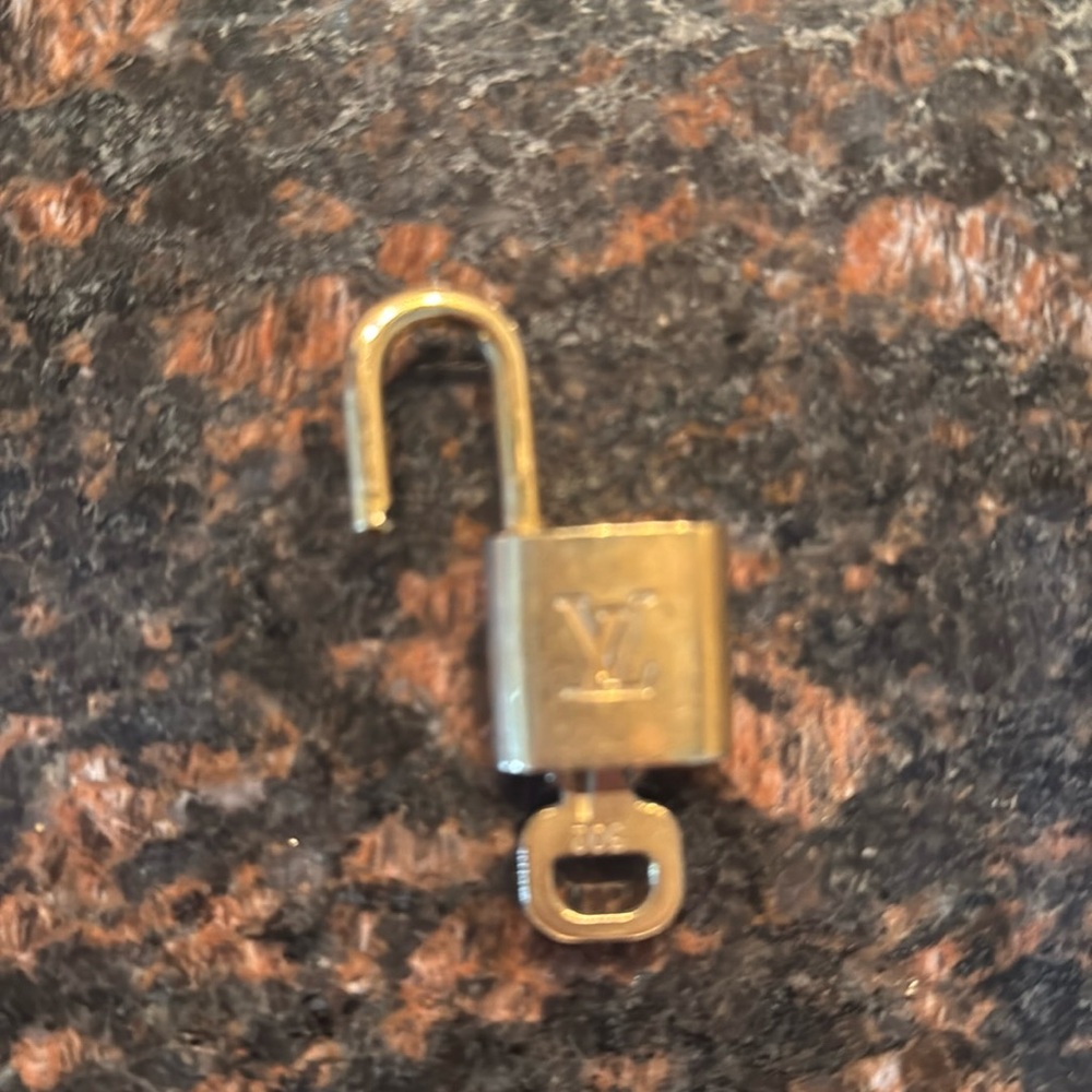 Authentic LV lock and key set  #302. Gold -tone vintagege. Pre-owned